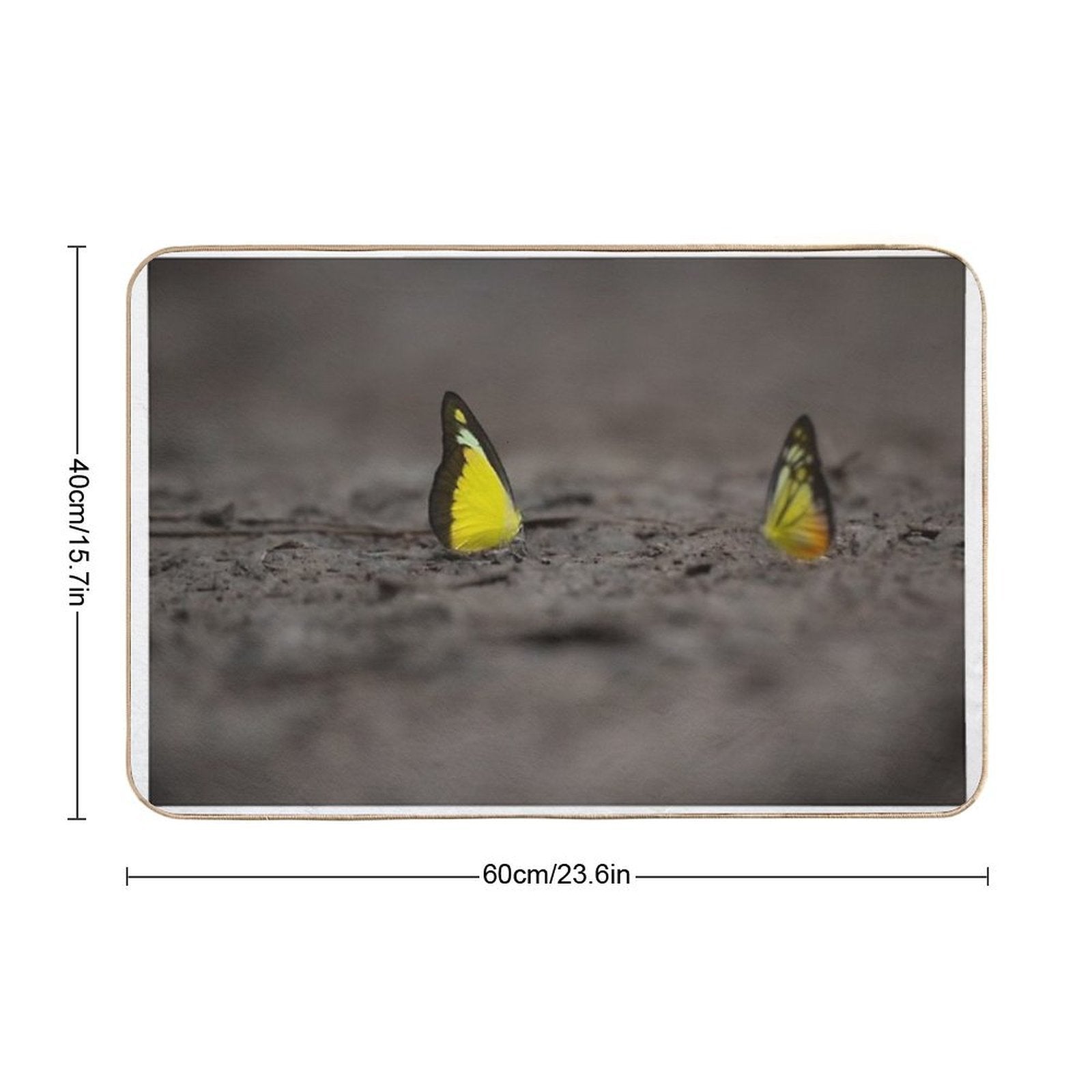 This Image Captures A Brightly Colored Butterfly Settled on Rugged Terrain, Offering A Striking Contrast Between Fragility And R  Versatile Bath Mat